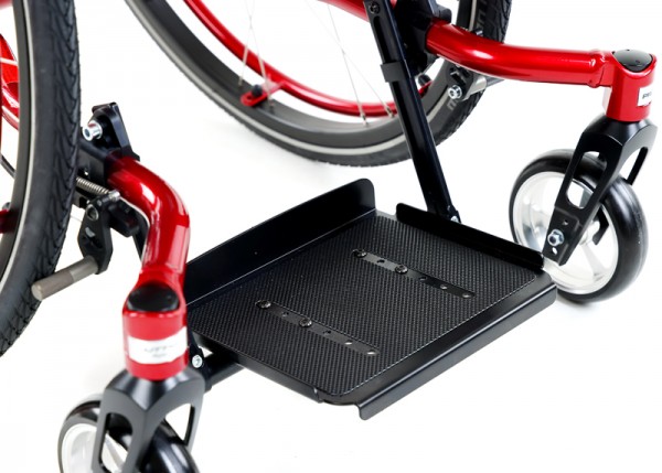 Foot support flips up to the rear, in standard position